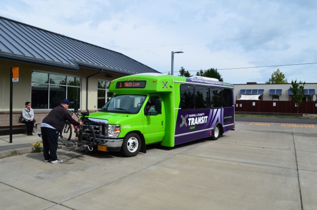 Bus 1805C Bike Being Loaded at the Transit Center Wide View