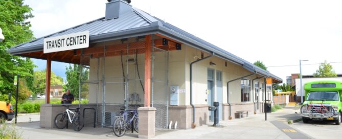 Transit Center Sign Wide View Angle Bus and Bikes Visible