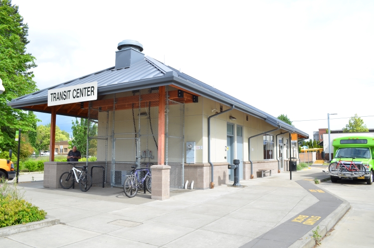 Transit Center Sign Wide View Angle Bus and Bikes Visible
